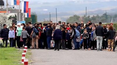 Ethnic Armenians evacuating Nagorno-Karabakh amidst rising tensions and conflict with Azerbaijani forces